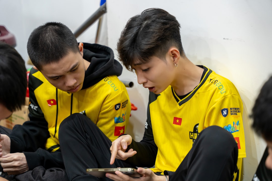 A group of young men sitting next to each other