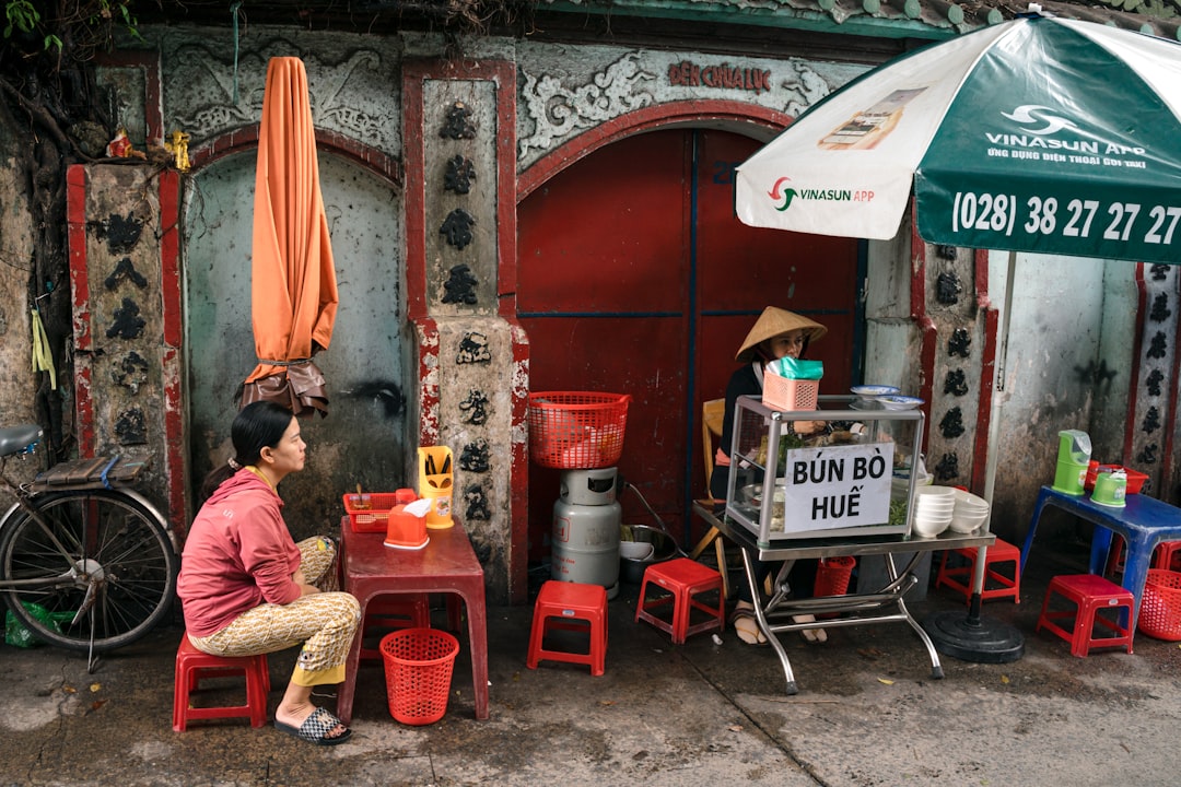 Street vendor in vietnam serving food.