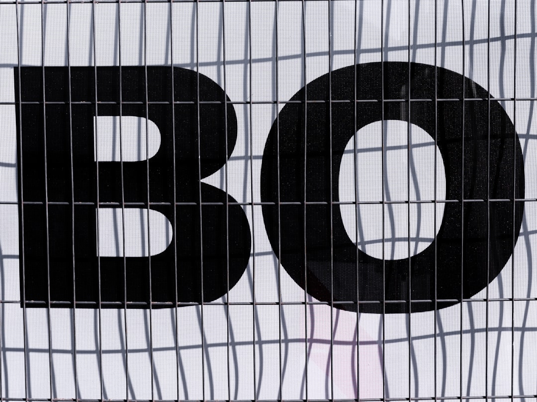The letters "bo" are shown behind wire mesh.